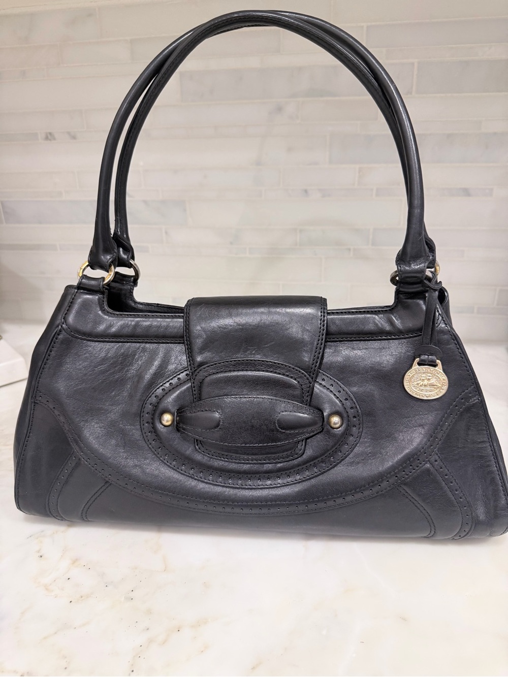 Brahmin Black Leather Shoulder Bag with Gold Medallion Charm